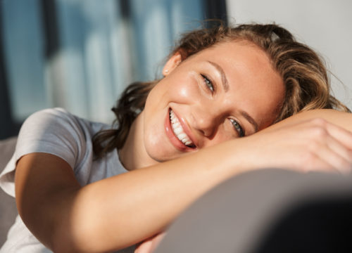 Smiling young woman after acne treatments