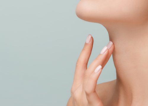 Focus on a woman's double chin area